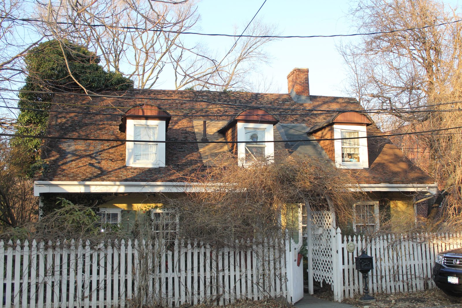 Riker–Lent–Smith Homestead behind its picket fence